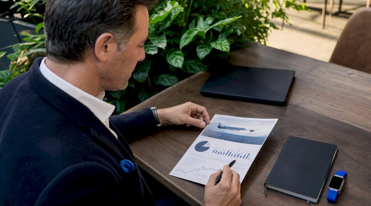 Business traveler reviewing flight membership ROI