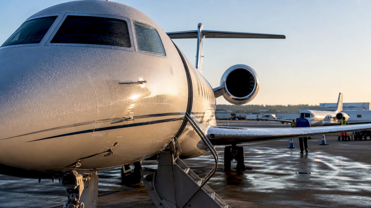 Lineup of private jets of various categories at airport