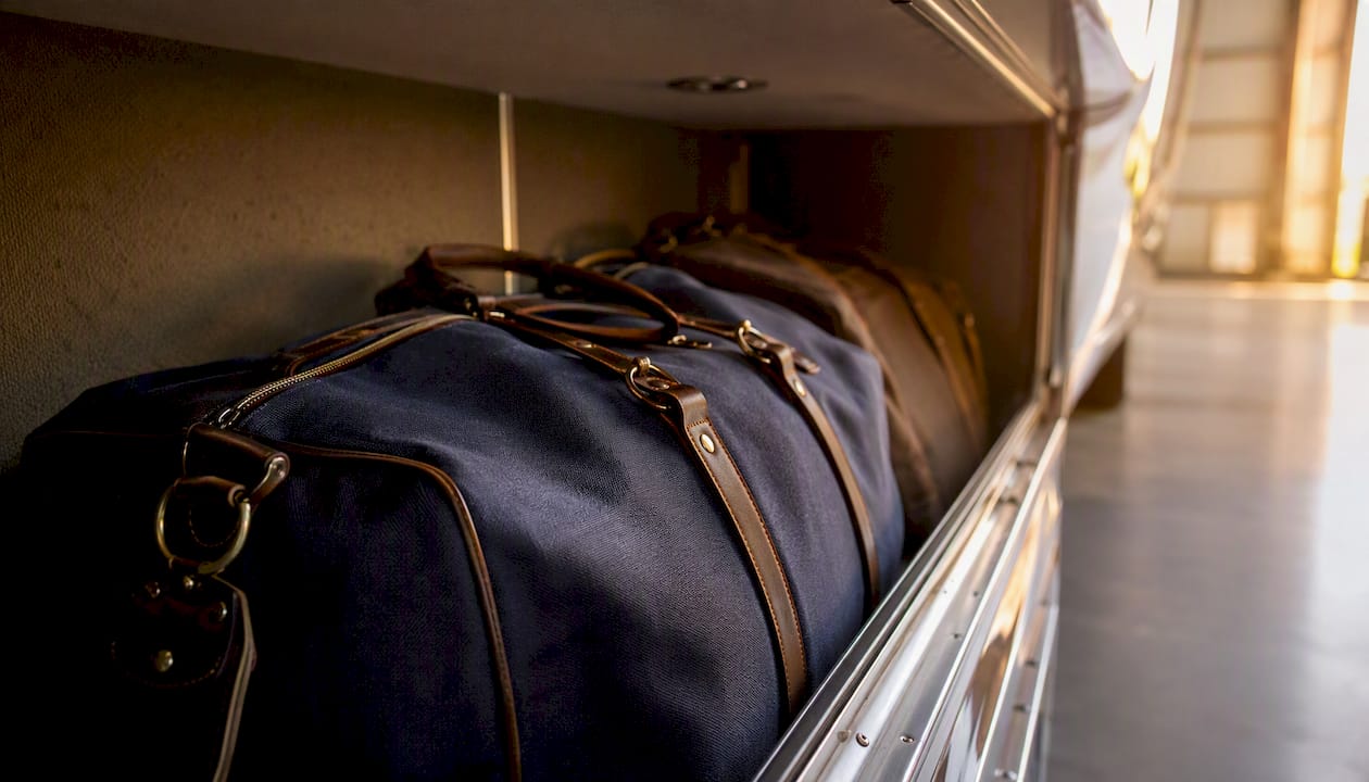 Soft duffel bags in private jet luggage hold