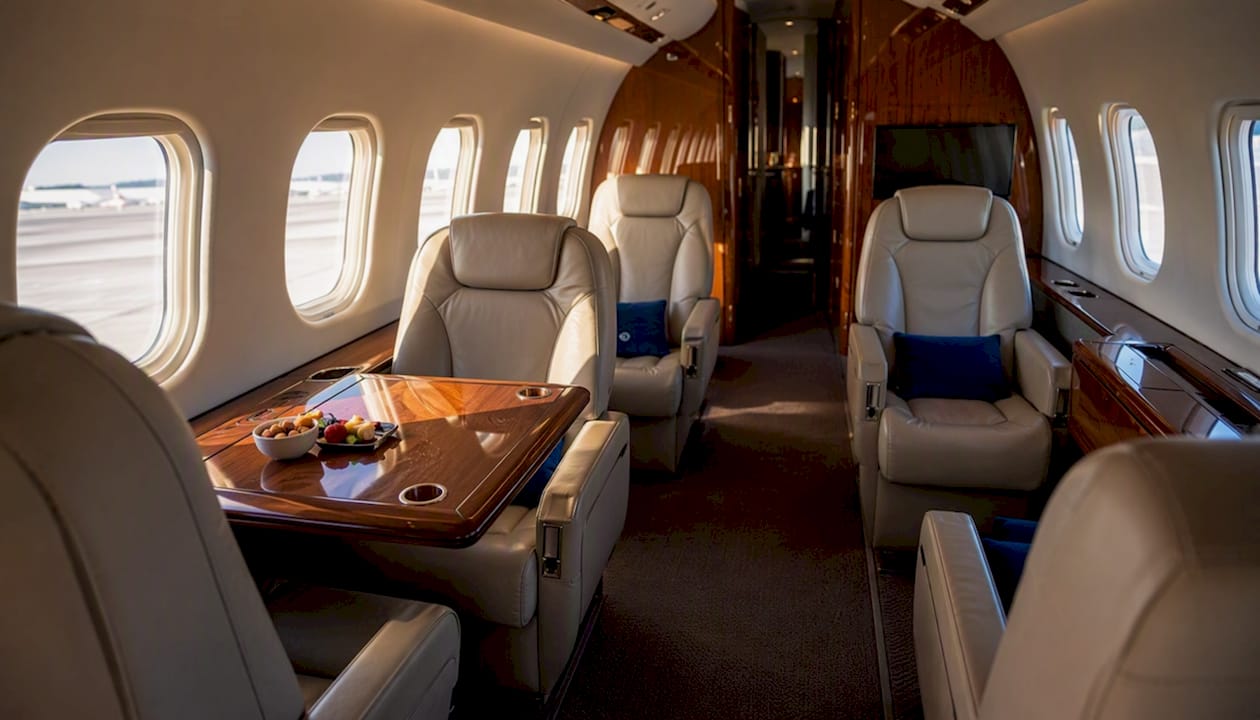 Private jet cabin with face-to-face club seating