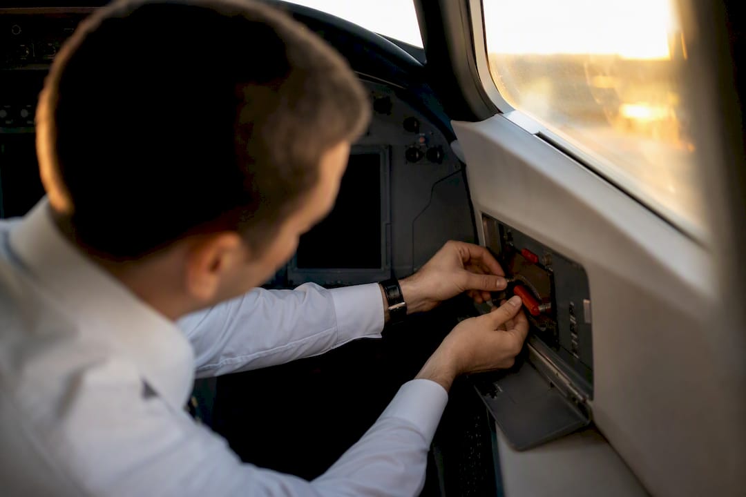 Crew member checking emergency equipment on jet