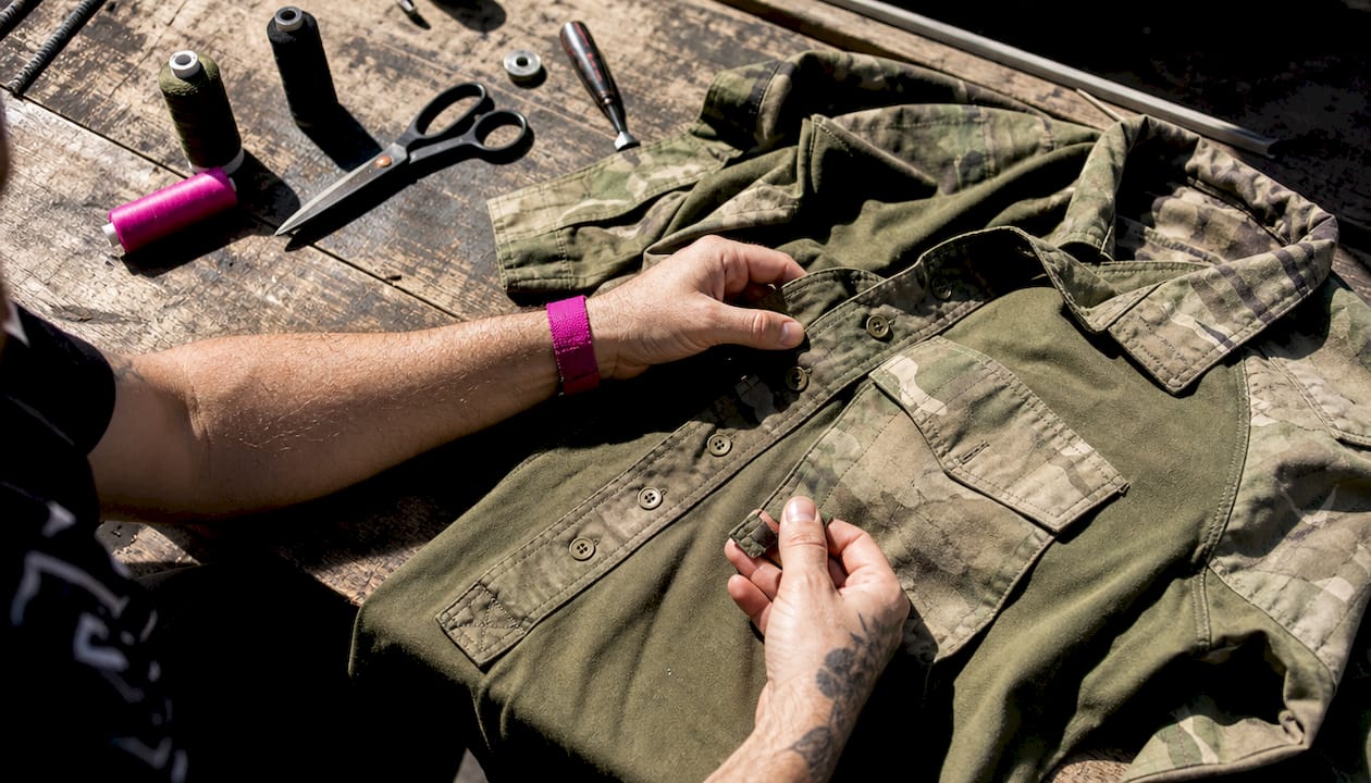 Close-up of military surplus shirt and sewing tools