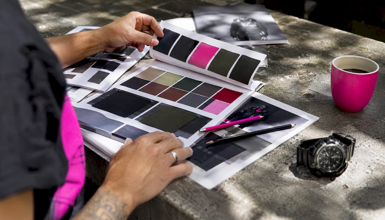 Hands comparing veteran apparel samples