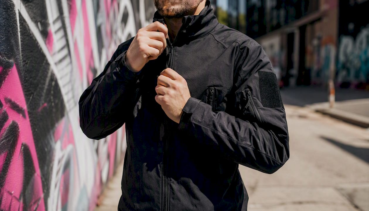 Civilian adjusting military-style streetwear jacket