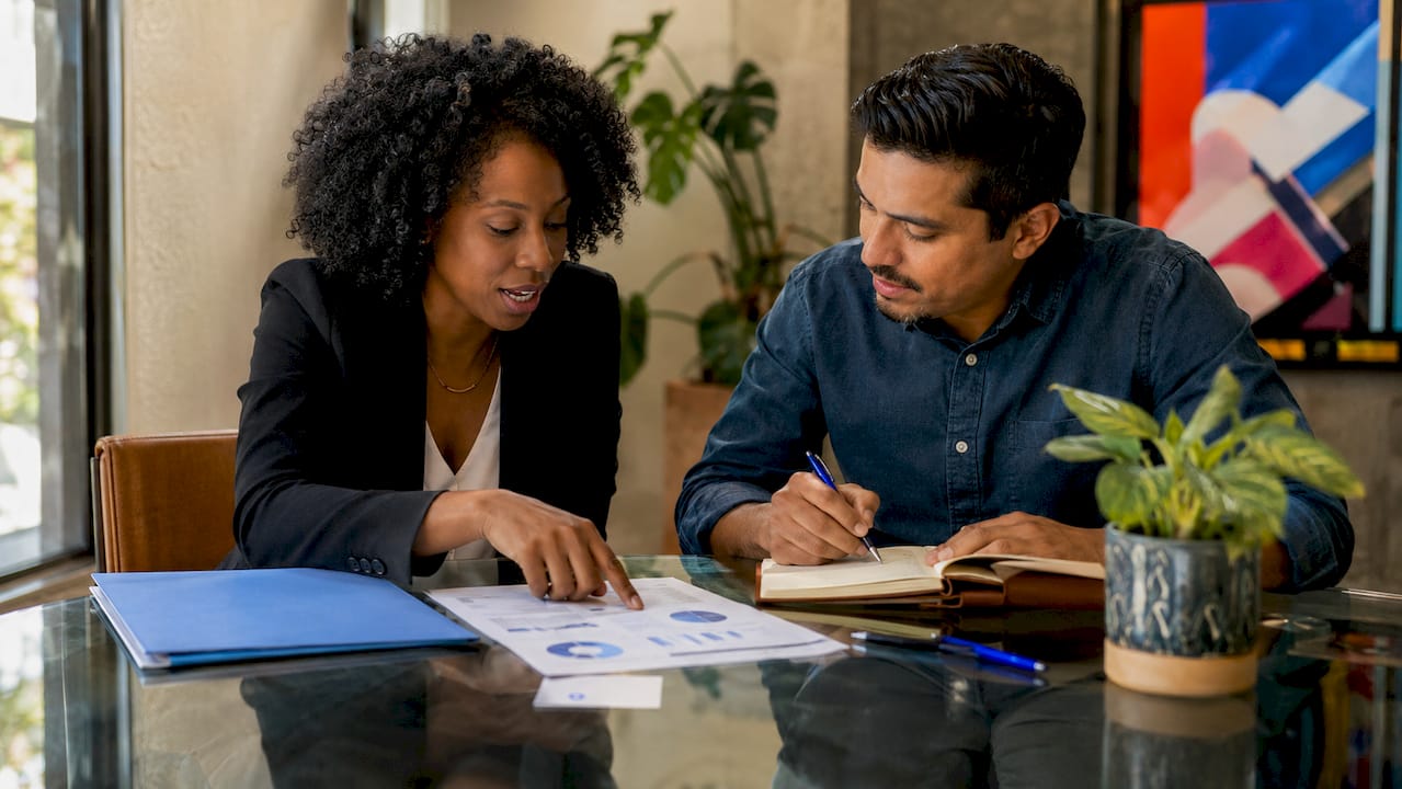 Team discussing hard money lender referral strategy