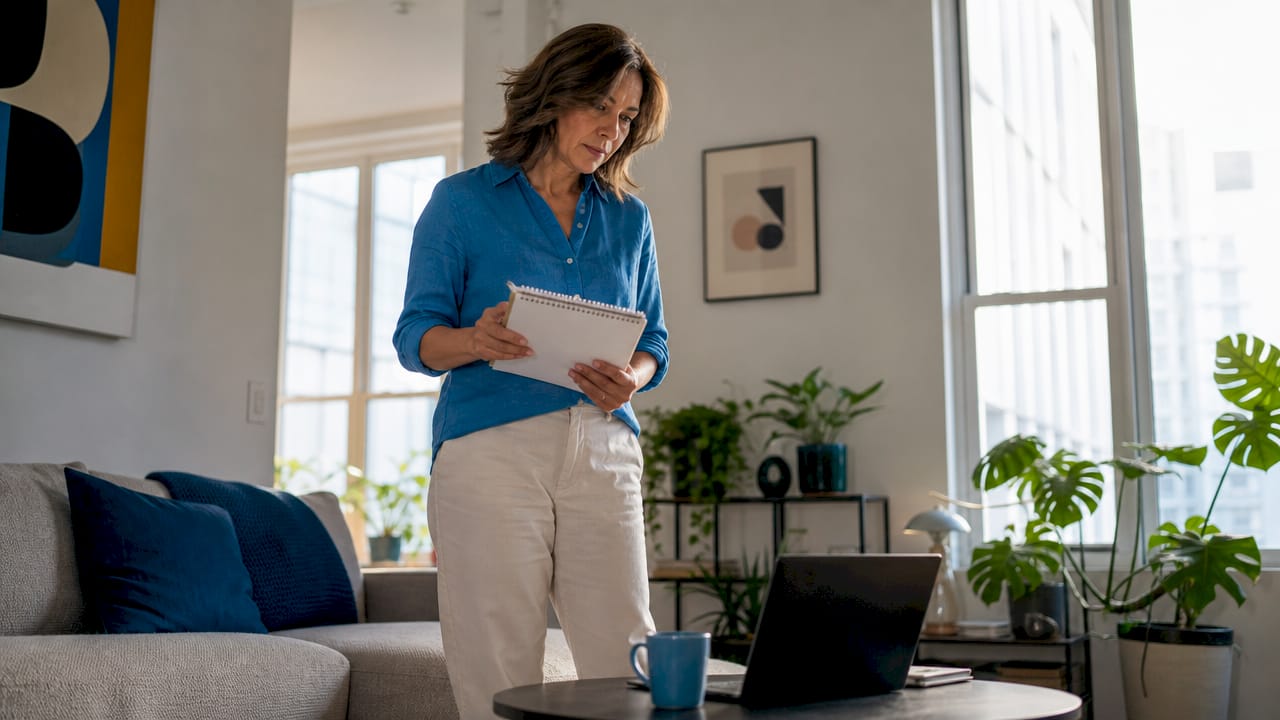 Woman reviewing notes for hiring cleaner