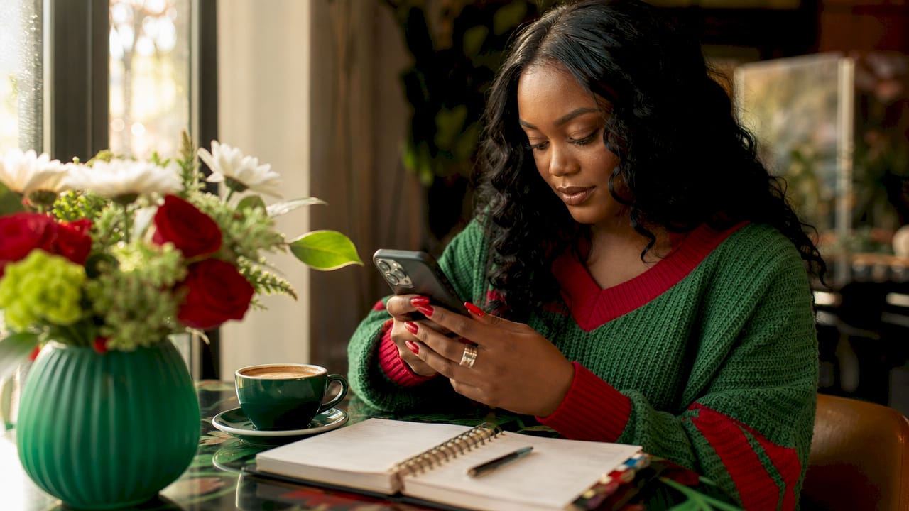 Cosmetologist managing social media on smartphone
