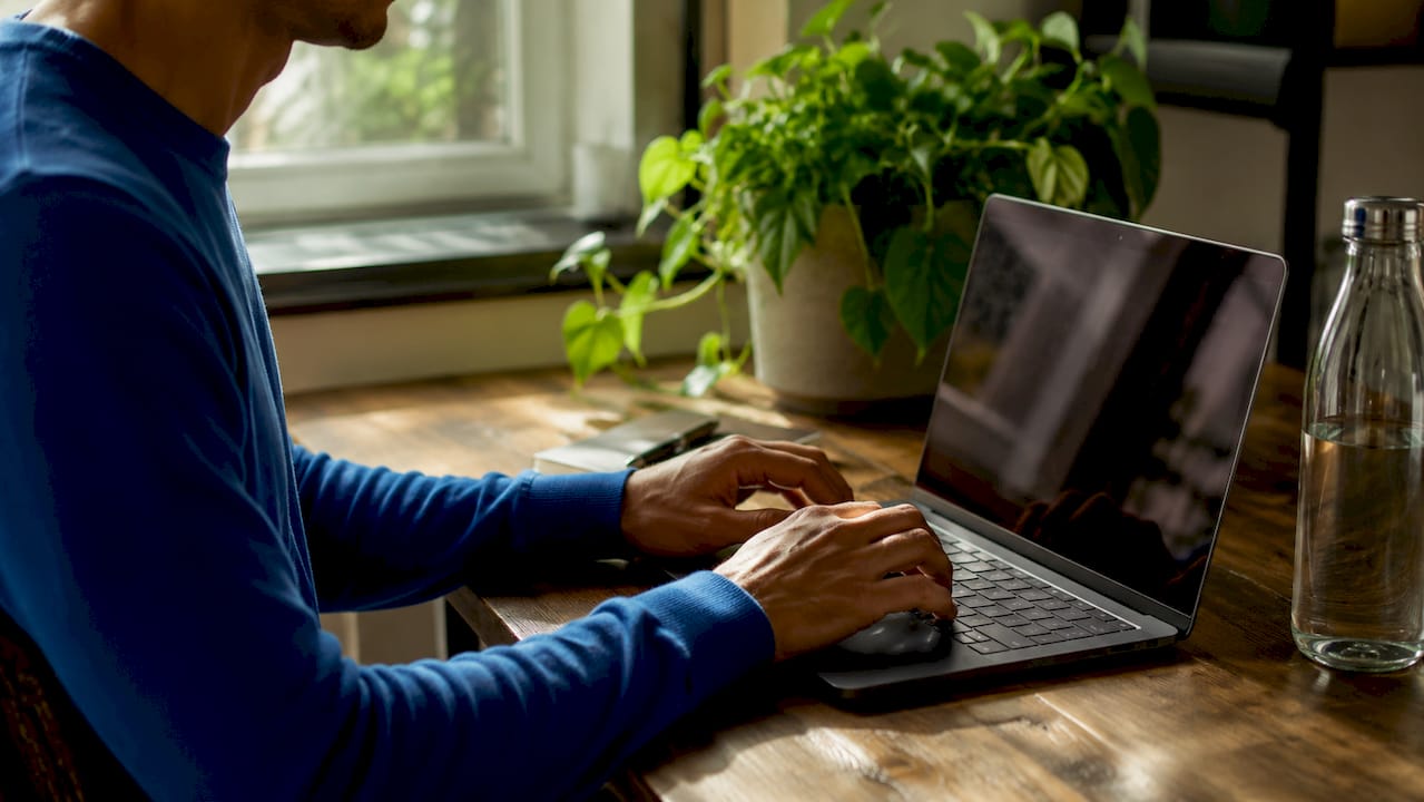 Hands typing email in shared inbox
