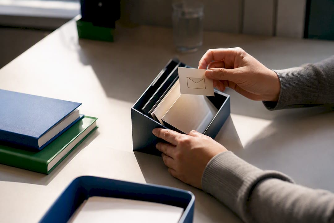 Hands adjusting send permissions token on desk