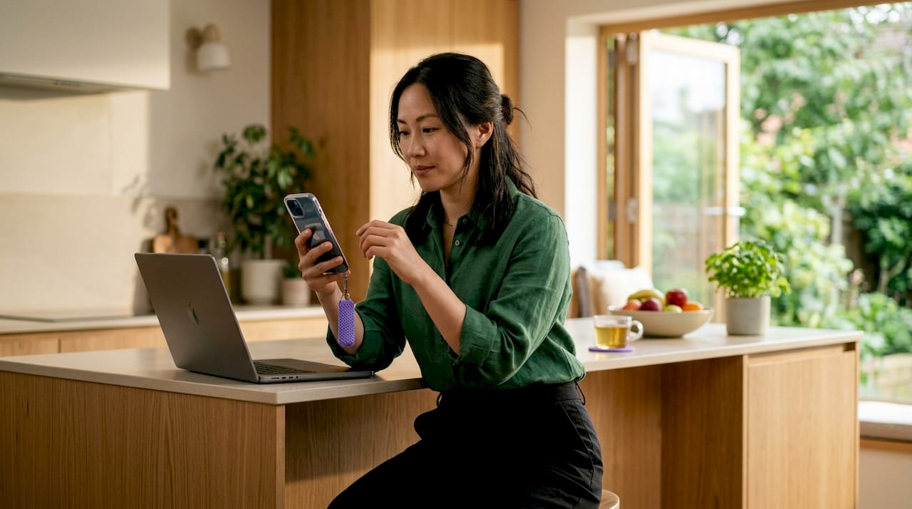 Woman using smartphone for automated onboarding
