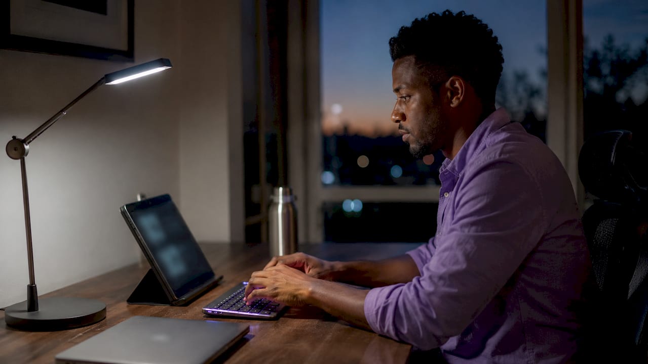 Hands typing workflow alerts home office