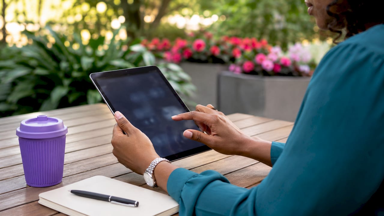 Hands using tablet showing client workflow types