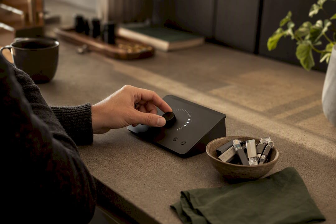 Hand adjusting reputation meter dial on desk