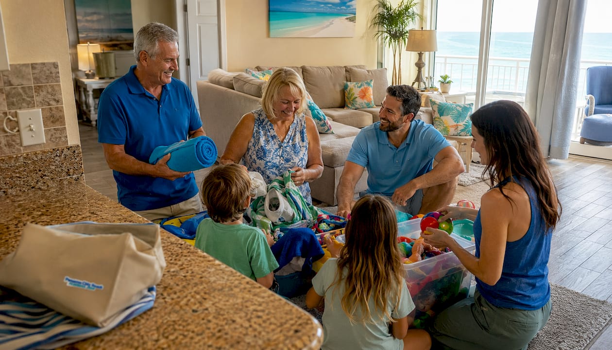 Family unpacking in spacious condo living area