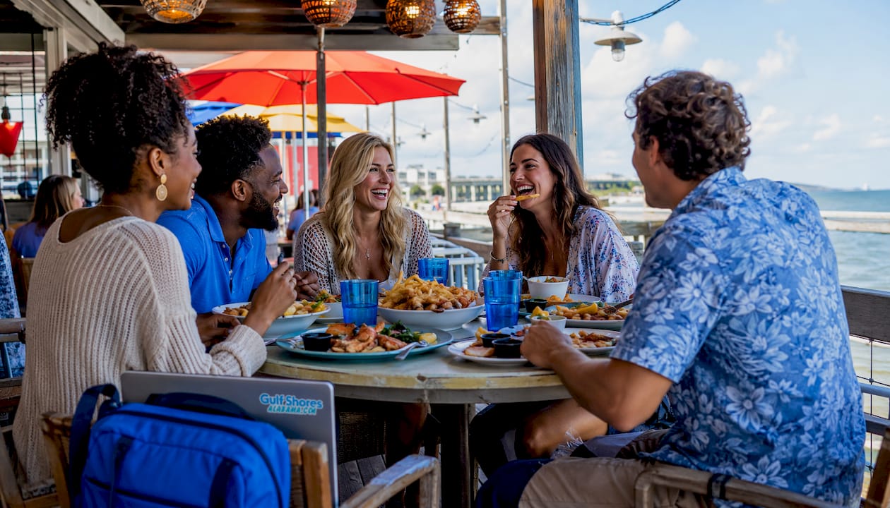 Family enjoying outdoor seafood dining