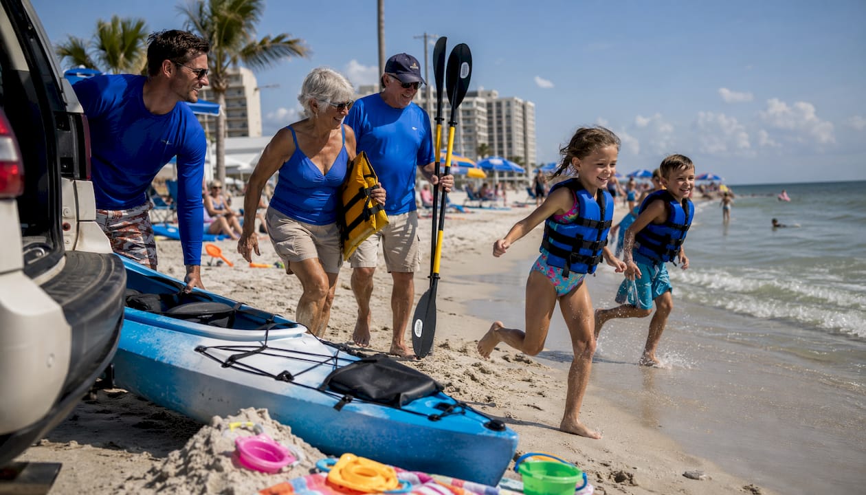 Family preparing kayaks for water activity