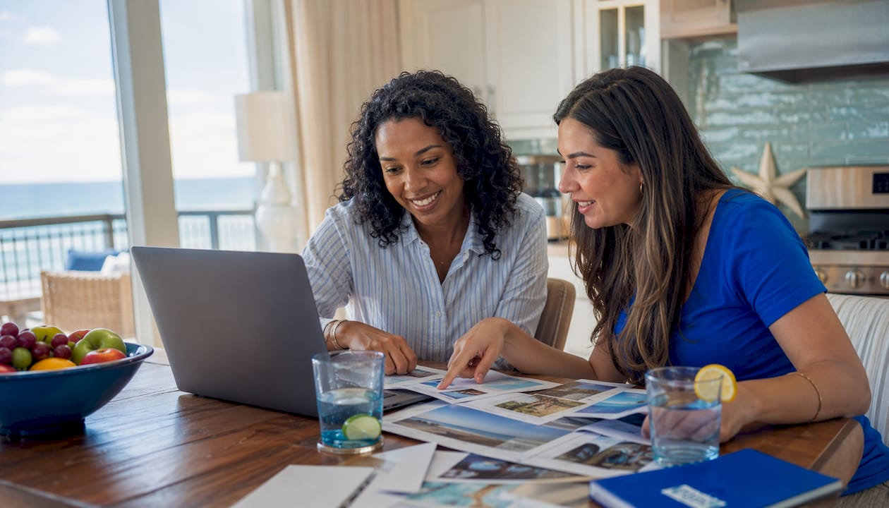 Group reviewing condo options at living room table