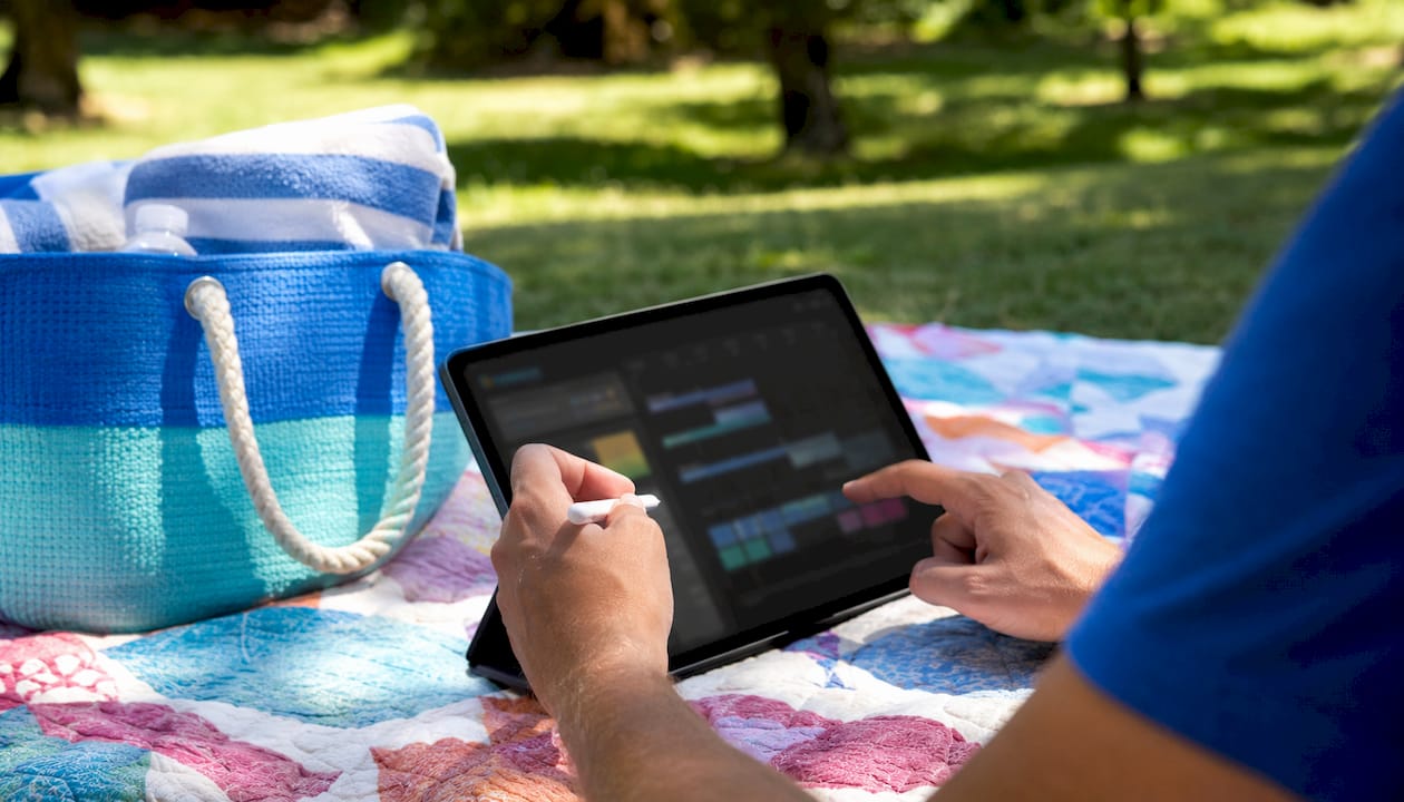 Hands using tablet to manage rental channels