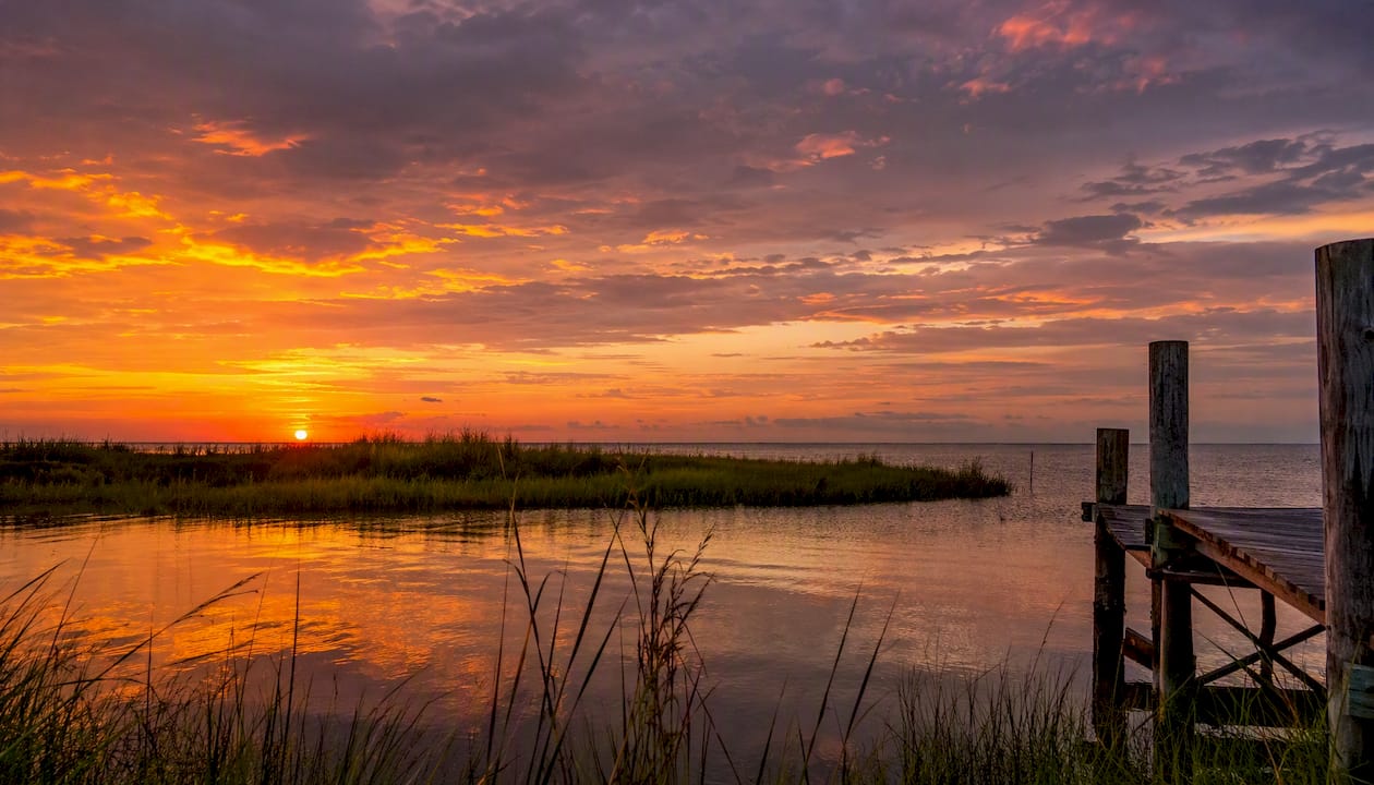 Sunset over marsh and water at Grand Isle, Louisiana