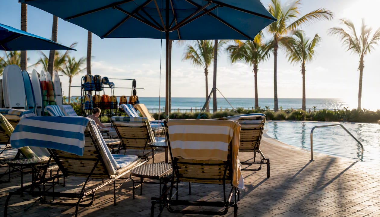 Beachfront resort pool area with Gulf Coast beach gear