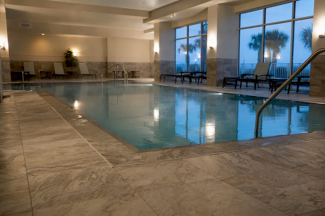 Calm indoor hotel swimming pool interior