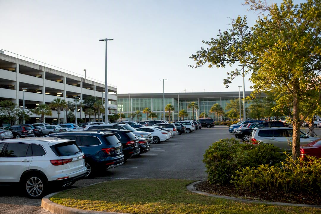 Regional airport parking lot and structure in daylight