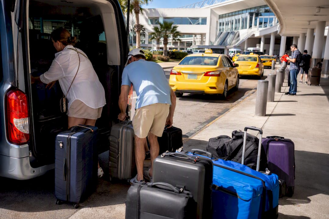 Multiple airport transfer options with luggage during busy arrival
