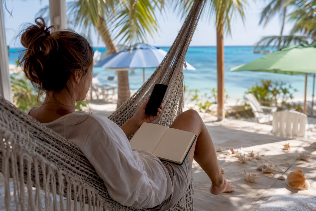 Vacation rental owner managing bookings on porch