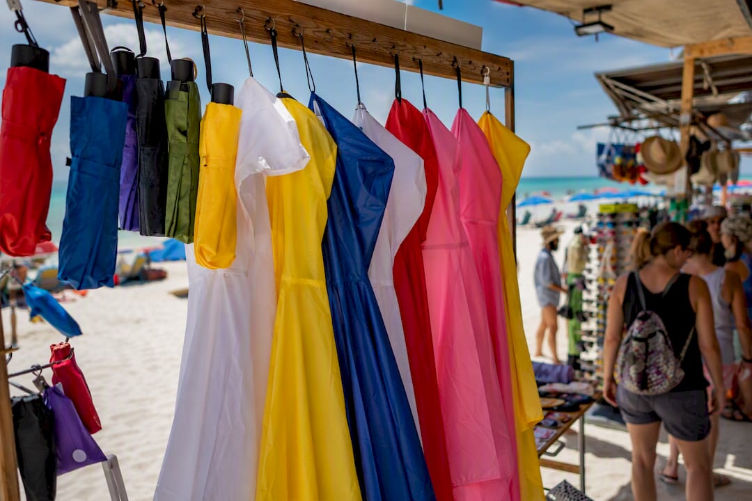 Packable ponchos and umbrellas in gift shop