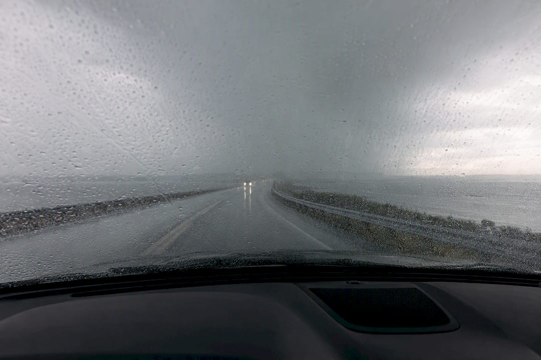 Rain reducing visibility on coastal causeway
