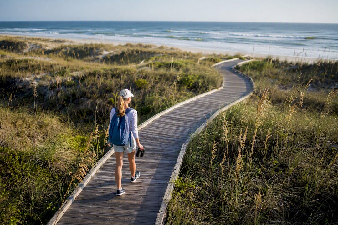 Boardwalk winding through Gulf State Park dunes