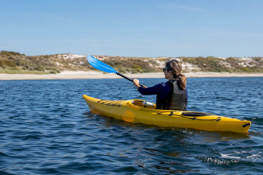 Paddler crossing channel toward Shell Island