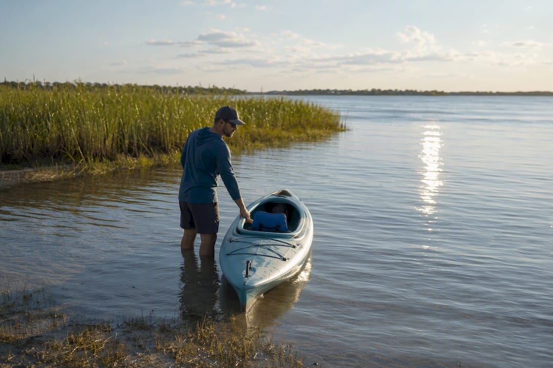 Paddler in calm shallow Little Lagoon water