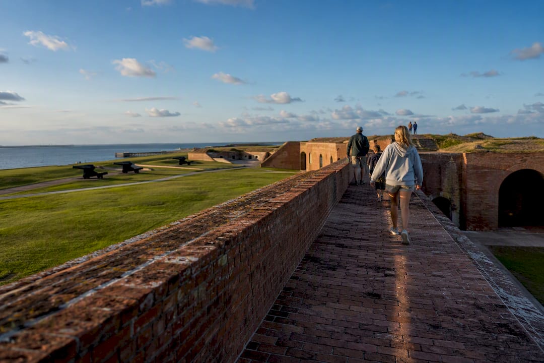 Visitors exploring Fort Morgan historic grounds