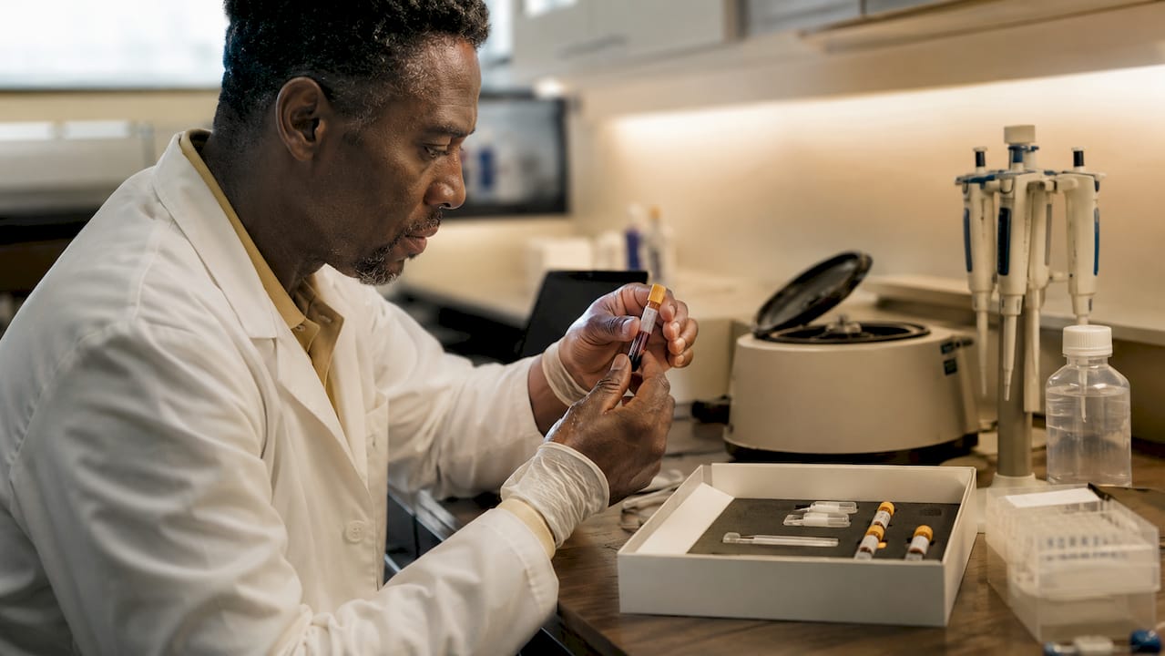 Lab technician handling biological age test samples