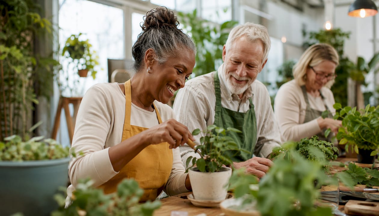 Community gardening group engaging socially outdoors