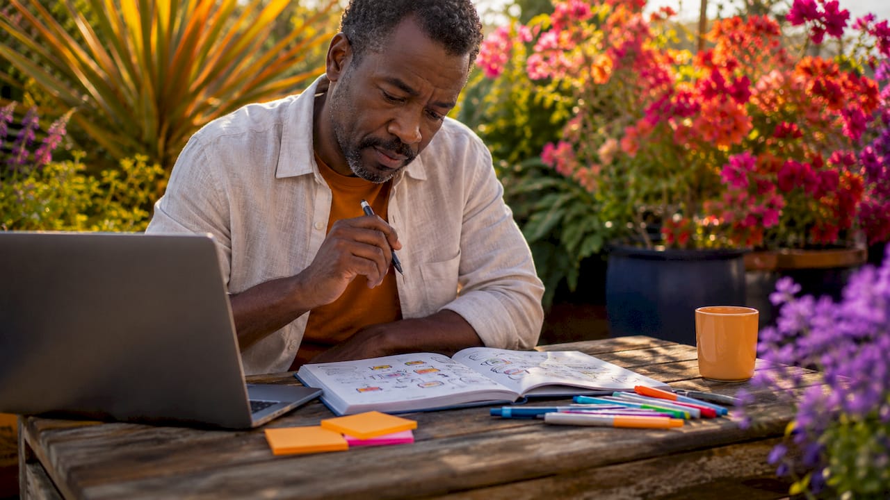 Man planning festival schedule using calendar and notes