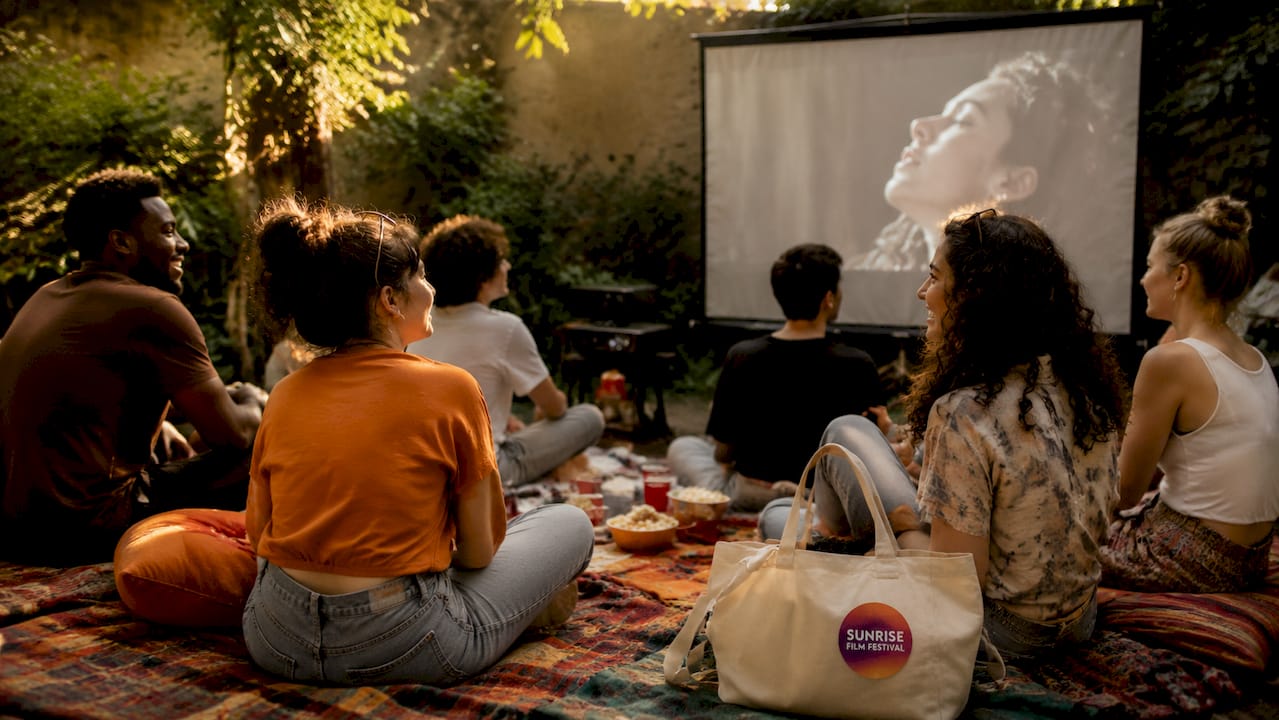 Audience watching indie film at festival screening