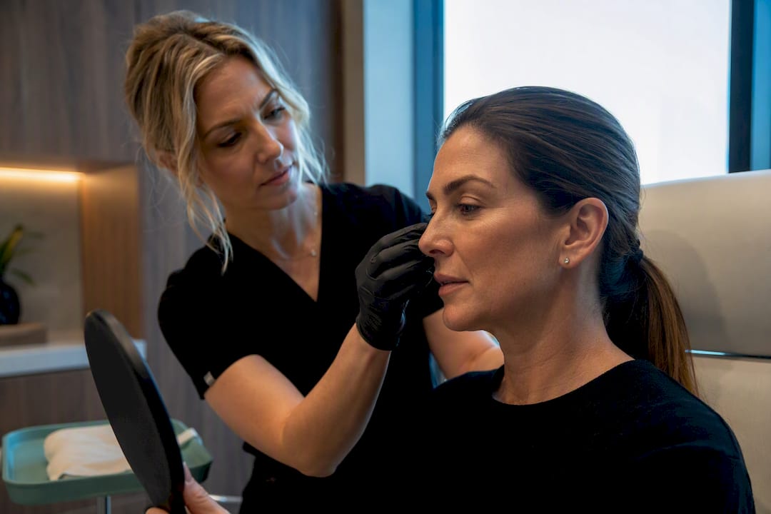 Clinician assessing patient’s midface structure
