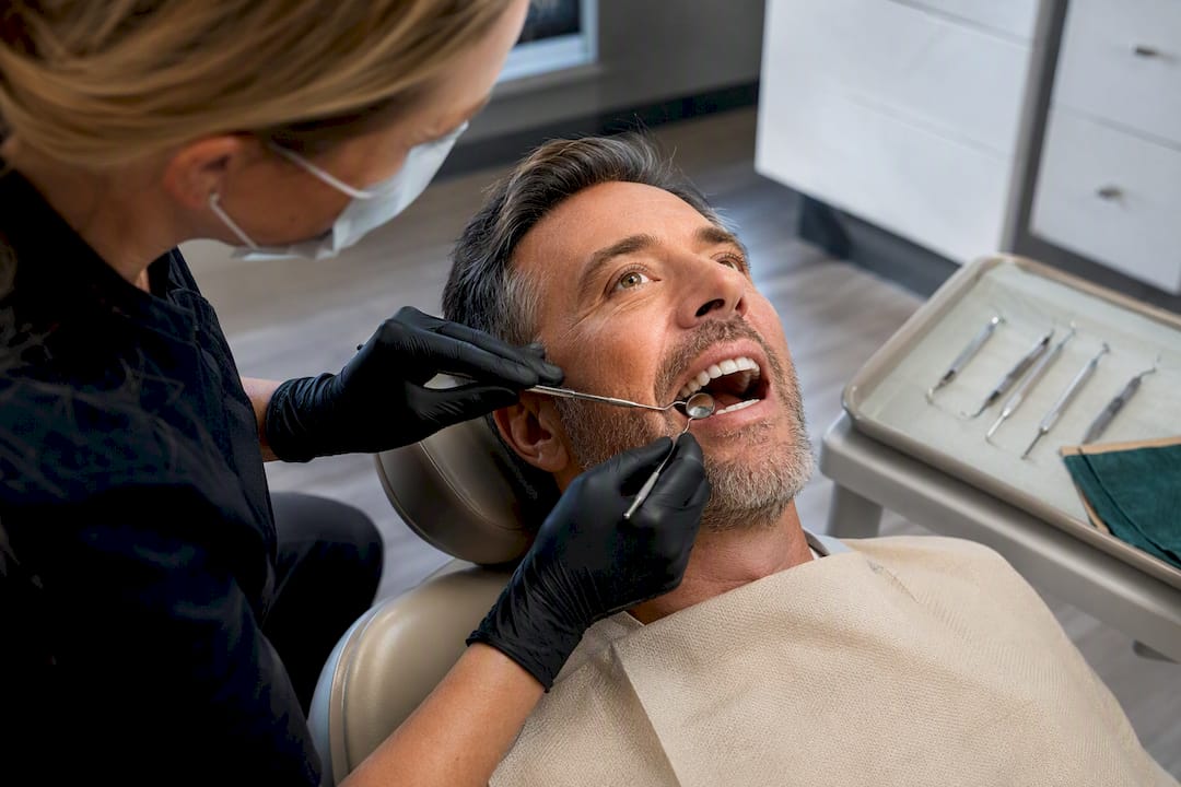 Hygienist performing supportive implant care