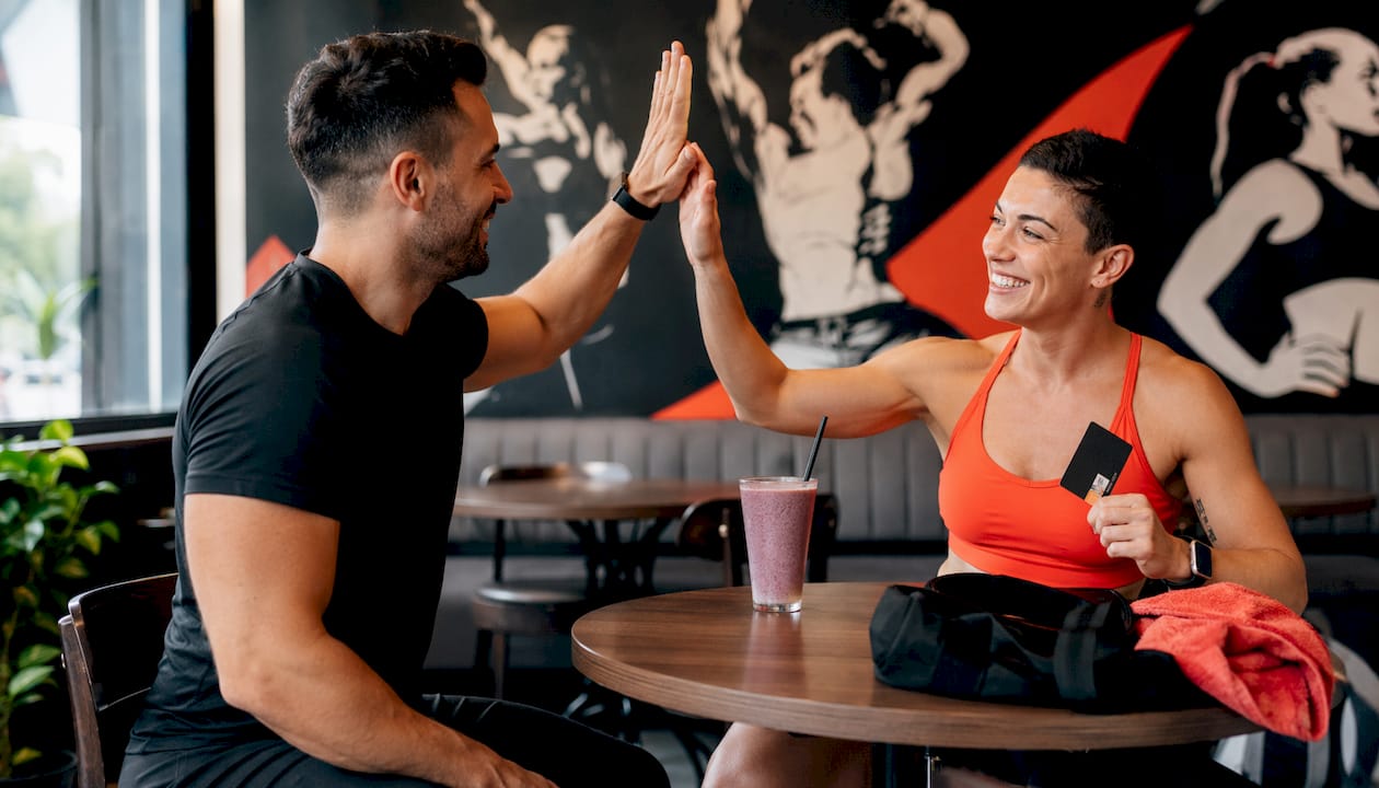 Trainer and client handshake after personal training session