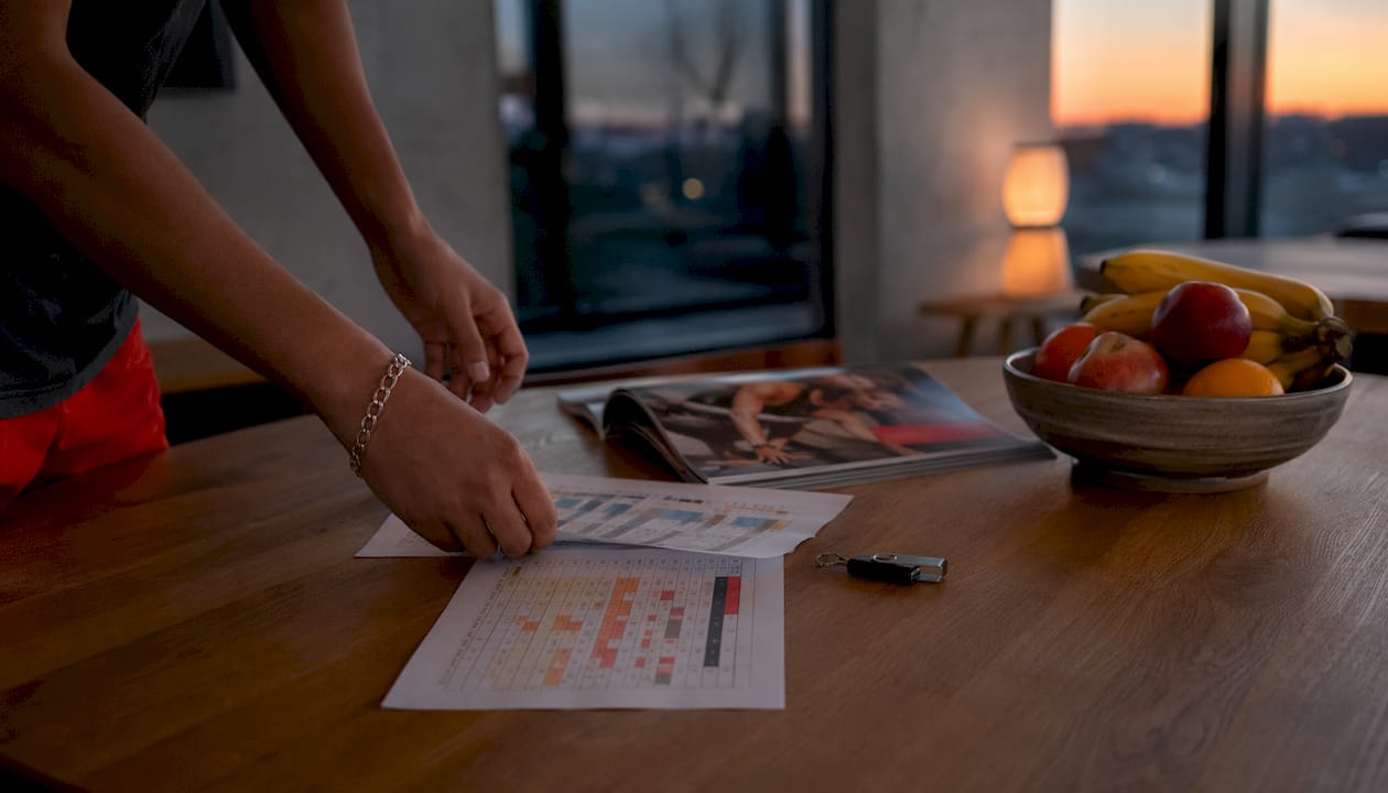 Hands holding data export sheets for platform migration