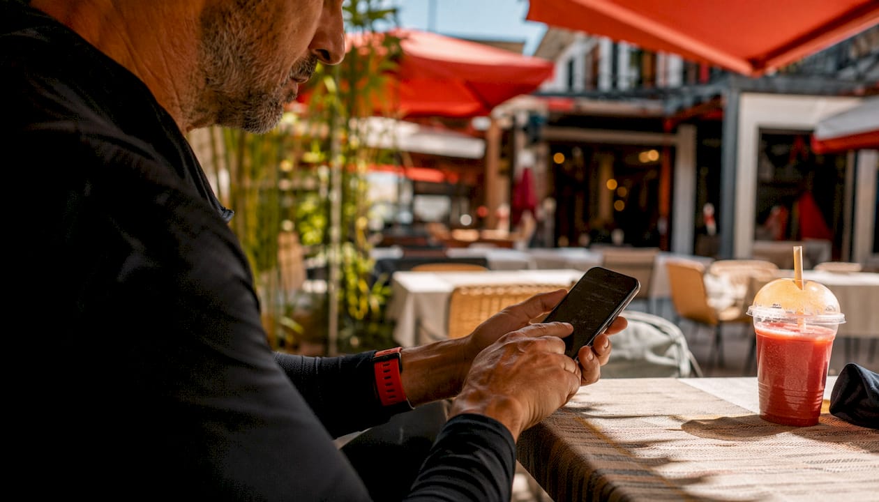 Hands interacting with booking app on phone
