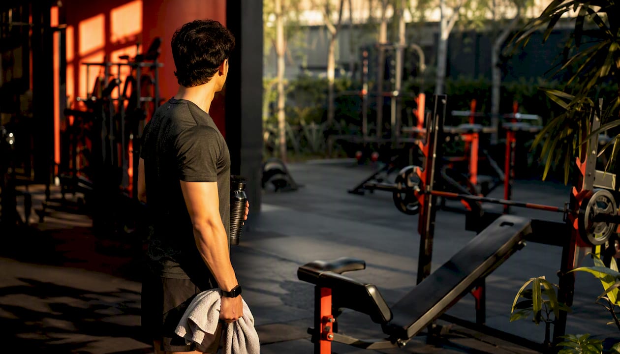 Trainer waiting at empty gym station