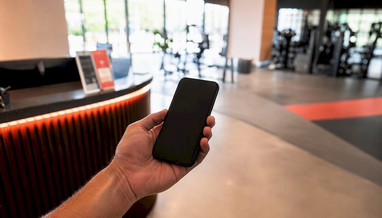 Hand holding phone receiving SMS notification
