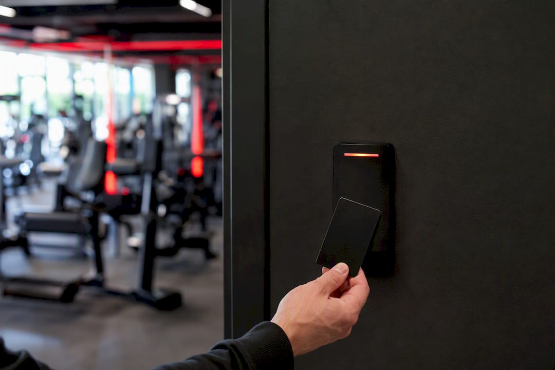 Hand swiping gym access card