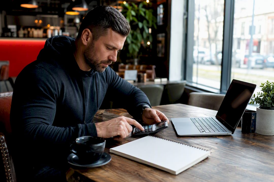 Gym owner calculating software costs