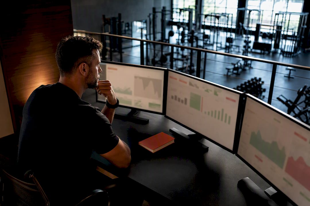 Owner comparing performance across gym locations