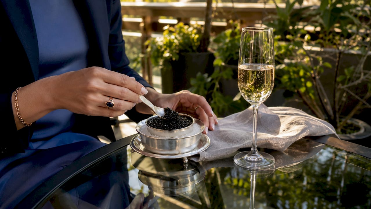 Close-up of Champagne and caviar pairing on table