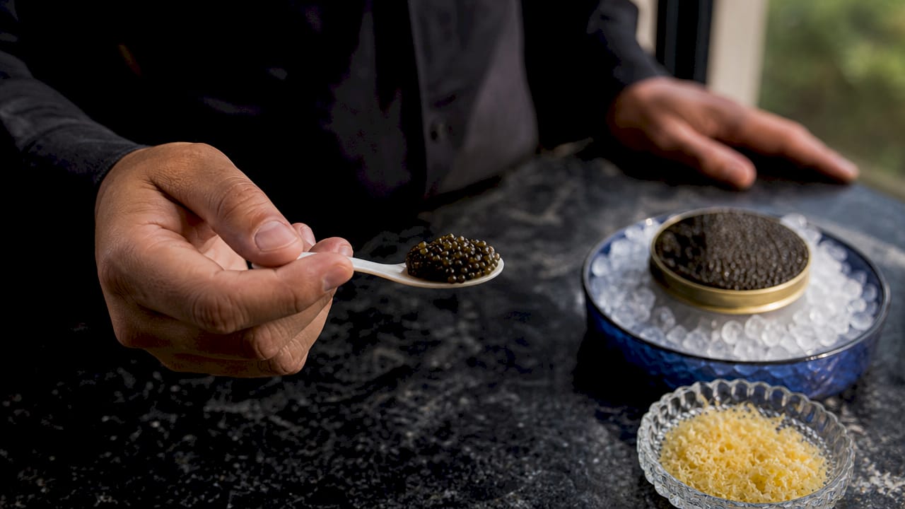 Close-up of mother-of-pearl spoon with Beluga caviar